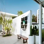 Blu Monkey Hub & Hotel Ranong sign and courtyard in Ranong town